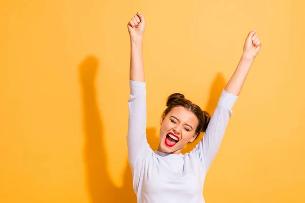Portrait of her she nice-looking attractive lovely winsome sweet cheerful cheery optimistic girl having fun rejoicing raising hands up party isolated on bright vivid shine yellow background — Stock Photo, Image