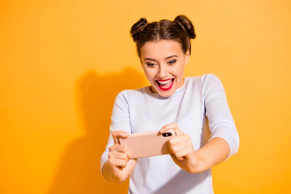 Close up photo of funky energetic addicted student playing video online games car racing on weekends wearing white sweater isolated on vibrant background — Stock Photo, Image