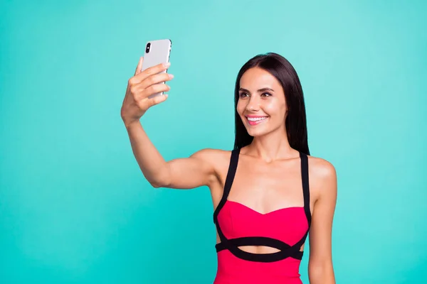 Close up photo beautiful amazing she her lady hold raised arm hand phone smart phone new post instagram followers social blogger formal-wear red dress isolated teal turquoise bright background —  Fotos de Stock