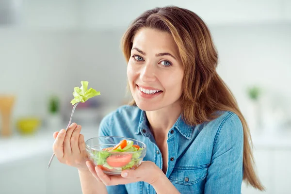 Close-up portrait of her she nice-looking lovely charming cute attractive shine cheerful cheery positive brown-haired lady tasting detox vitamin salad in light white interior style kitchen — Stock Photo, Image