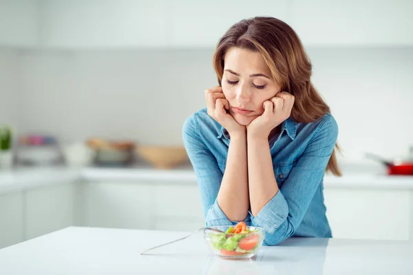 Close-up portrait of her she nice lovely charming attractive sad bored dull disappointed brown-haired lady looking at new green detox vitamin salad in light white interior style kitchen — Stock Photo, Image