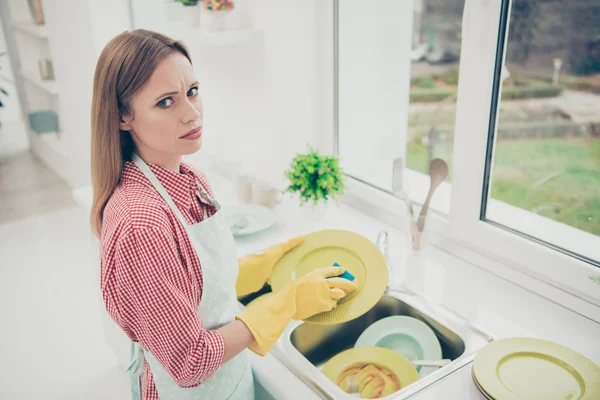 Close up side profile photo beautiful she her lady cleaner bright kitchen hold dirty plate spring cleanup dislike prepare family meeting holiday wear casual jeans denim shirt avental flat inside — Fotografia de Stock