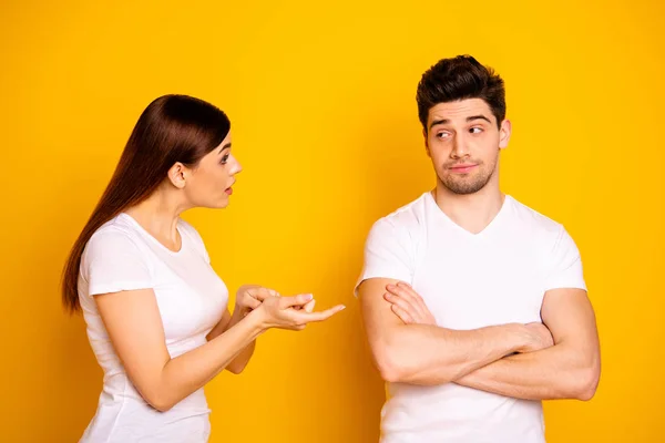 Close up side profile photo two beautiful people she her he he his blame aggression hands arms crossed folded not listen care lecture scolding wear casual white t-shirts isolated yellow background — Fotografia de Stock