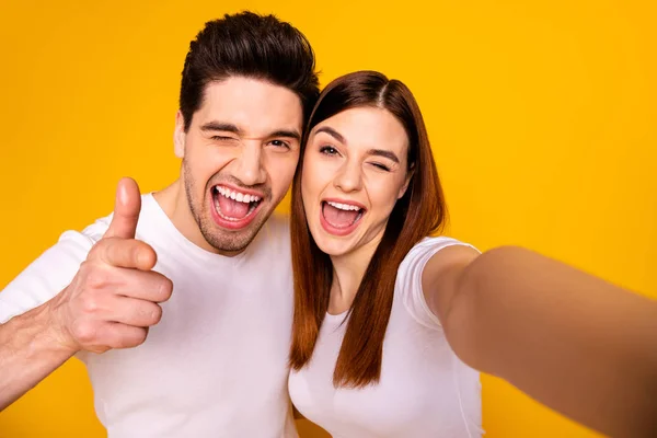 Self-portrait of his he her she two nice attractive lovely charming cute stylish trendy cheerful optimistic people showing thumbup isolated over vivid shine bright yellow background — Stock Photo, Image