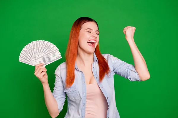 Portrait of positive cheerful satisfied youth content scream aim get wages raise fists ecstatic beautiful stylish close eyes yeah shout dressed jeans outfit long straight hair isolated on ngreen — Stock Photo, Image