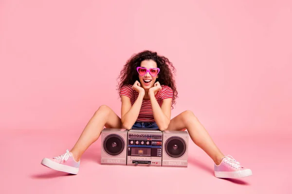 Portrait of her she nice-looking cool attractive lovely charming cheerful cheery wavy-haired lady sitting leaning on player night club clubber nightlife isolated over pink pastel background — Stock Photo, Image