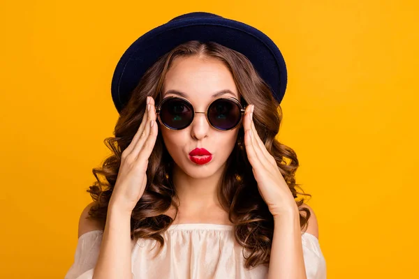 Close-up portrait of her she nice-looking attractive fascinating lovely pretty girlish shy modest wavy-haired lady touching round glasses isolated over bright vivid shine yellow background — Stock Photo, Image