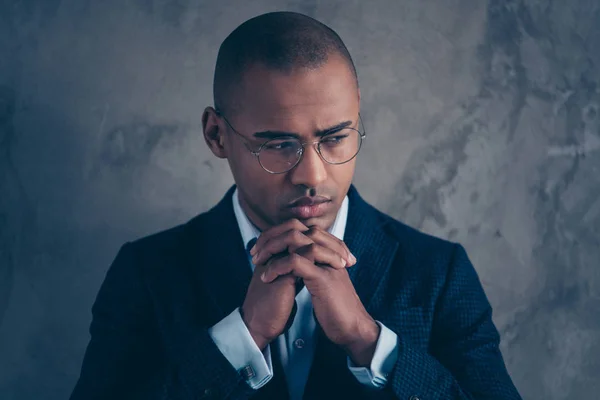 Close up photo portrait of cool modern masculine virile banker manager marketer holding hands palms together looking aside isolated grey background