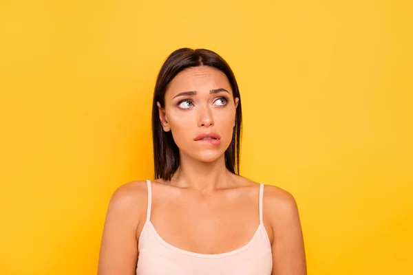 Close up photo beautiful she her her lady look empty space fear hide eyes bite lip bad wrong unsuitable situation feel guilty wear casual pastel tank-top outfit ropa aislada amarillo brillante fondo — Foto de Stock