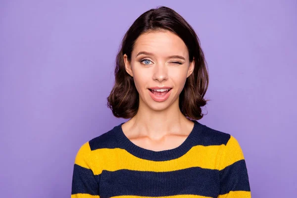 Close up photo beautiful amazing funky she her lady pretty overjoyed impressed winking eye coquettish boyfriend husband wear blue yellow striped pullover isolated violet purple background — Stock Photo, Image