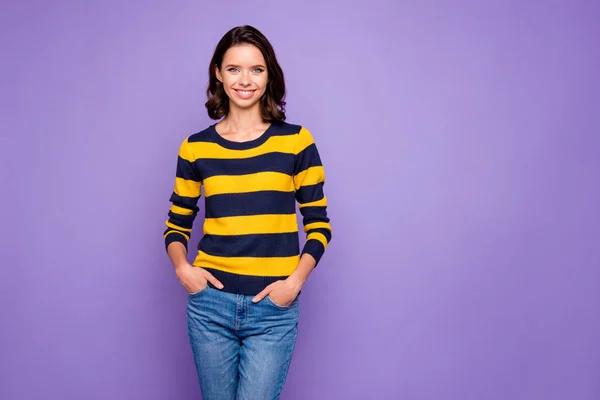 Close up photo beautiful amazing she her her lady ideal white teeth sincere kind hands arms pockets easy-going listening great good news wear blue yellow striped pullover isolated violet purple background — Foto de Stock