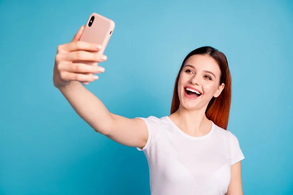 Close-up portrait of her she nice attractive lovely sweet winsome cheerful cheery glad girl wearing white tshirt taking making selfie isolated over bright vivid shine blue background — Stock Photo, Image