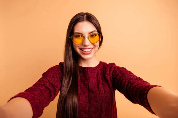Close up photo beautiful her she lady modern look make take selfies instagram post followers speak talk tell skype video call wear specs casual red burgundy pullover isolated beige pastel background — Stock Photo, Image