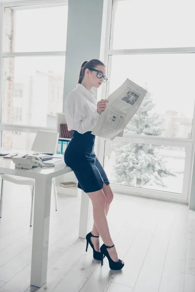 Vertical full length side profile body size photo she business lady eyewear eyeglasses hands arms fresh press reader article partnership company wear specs formal-wear white shirt skirt bright office — Stock Photo, Image