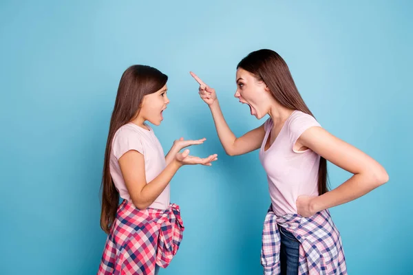 Profile side view portrait of two nice attractive fury furious crazy straight-haired girls having fight scolding bad behavior mood isolated on bright vivid shine green blue turquoise background — Stock Photo, Image