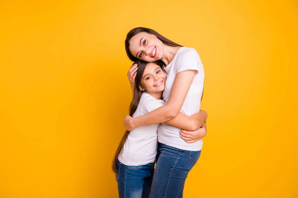 Close up side profile photo beautiful her she diversity lady different age hold hands arms each other waited meeting buddies wear casual white t-shirts jeans denim isolated yellow bright background — Stock Photo, Image