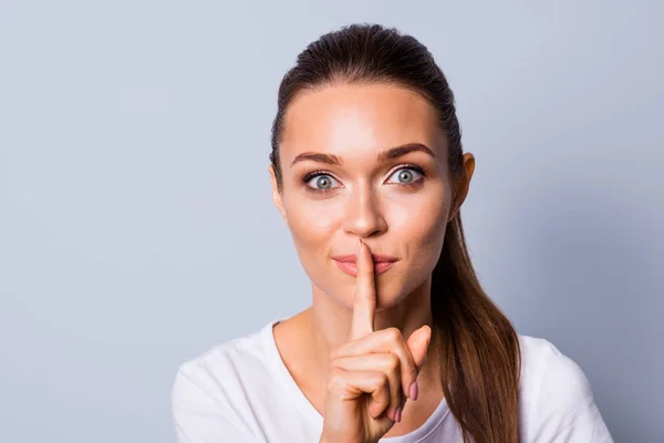 Close up photo beautiful amazing she her her lady ideal appearance secret information hush finger lips mouth please stop talk tell speak chatterbox wear casual white t-shirt isolated grey background —  Fotos de Stock