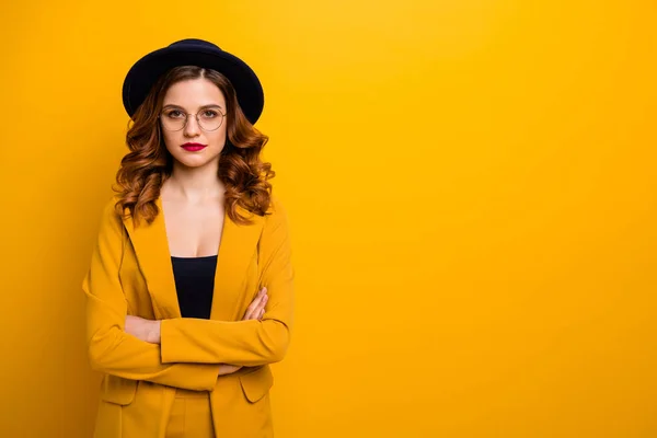 Portrait of her she nice-looking charming cute beautiful chic elegant elegant serious wavy-haired lady in yellow jacket folded arms isolated on bright vivid shine orange background — Stok Foto