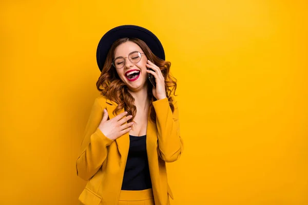 Close up photo beautiful funky she her lady arm hand telephone chat speak talk say tell friends relatives humor joke story wear specs formal-wear costume suit isolated yellow vibrant background — Stock Photo, Image