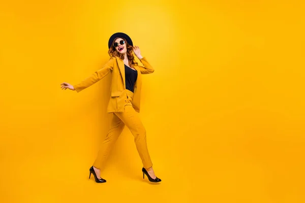 Full length side profile body size photo beautiful amazing funky she her lady walking down street perfect look tourism traveler wear specs formal-wear costume suit isolated yellow bright background — Stock Photo, Image