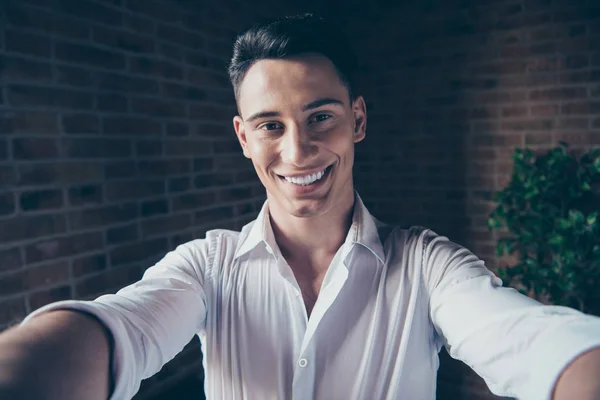 Close up photo handsome he him his macho guy cheer friendly look watch telephone smart phone make take selfies toothy smile notebook table stand office wear formal-wear white shirt — Stock Photo, Image