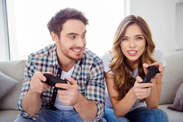 Portrait of his he she she two person nice-looking lovely cheerful cheery guy lady playing online station weekend in light white style interior hotel house indoors — Stok Foto