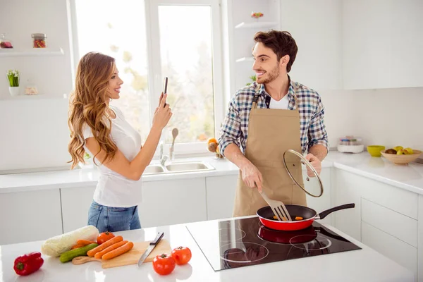 Close up photo two people beautiful he he he his macho she her lady romance phone hands master class blogger make video recipe instagram followers post apartments bright white kitchen room indoors — Foto de Stock