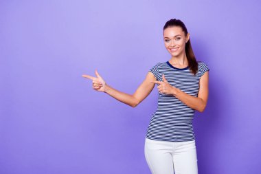 Portrait charming pretty millennial confident cool promoter advertise give feedback advise choose decide information discount present fashionable outfit trousers ponytail isolated purple background clipart