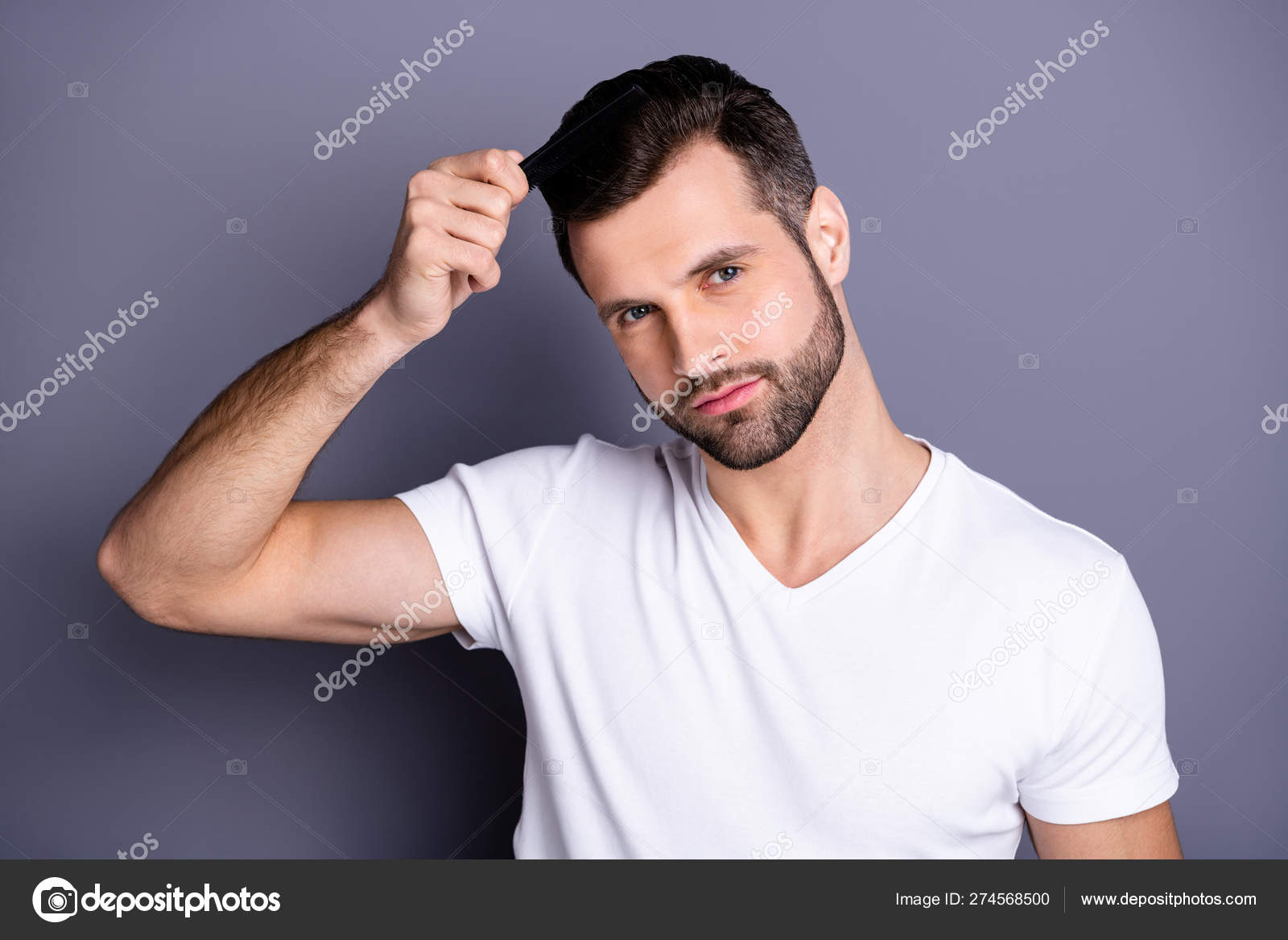 Close up photo amazing he him his macho perfect appearance hands arms plastic hair styling brush take care hairdo after barber shop stylist visit wear casual white t-shirt isolated grey background Stock Close up photo amazing he him his macho perfect appearance hands arms plastic hair styling brush take care hairdo after barber shop stylist visit wear casual white t-shirt isolated grey background Stock