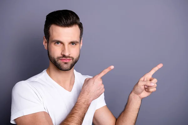 Close up photo amazing he he he he his macho perfect ideal appearance neat bristle index fingers indicating empty space novty advising buy buyer wear casual white t-shirt isolated grey background — Foto de Stock