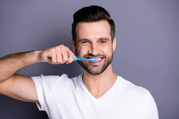 Close up photo amazing he him his macho cleaning mouth buy buyer new hand novelty plastic personal equipment tooth brush shower prepare working day wear casual white t-shirt isolated grey background — Stockfoto