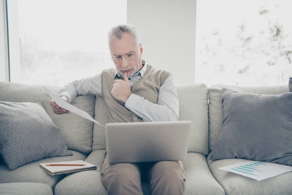 Close up photo amazing he him his aged man hands arms notebook search analyzer check compare information charts stats wear white shirt waistcoat pants sit cozy divan flat house living room indoors — Stock Photo, Image