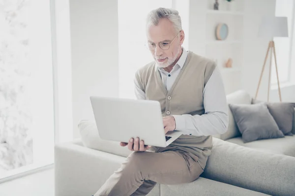 Close up photo amazing intelligent he him his aged man hands arms notebook search look information writing keyboard wear white shirt waistcoat pants sit cozy divan flat house living room indoors — Stock Photo, Image