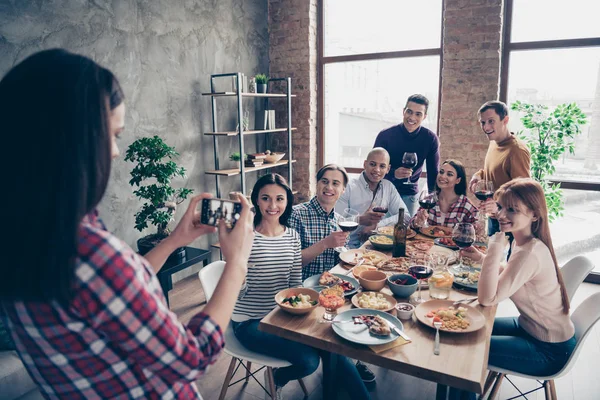 Close up photo friendly company event different race guys raise glasses beverage look camera telephone tradition image sit table shirts formal-wear sweater pullover loft room cafe restaurant indoors — Stock Photo, Image