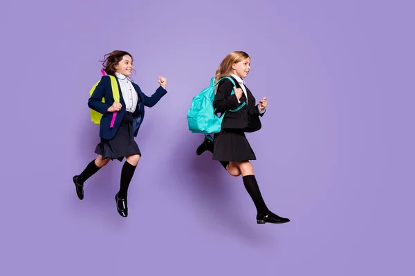 Full size profile side photo sweet kids run late elementary school wear skirt long socks stylish trendy isolated over purple violet background — Stock Photo, Image