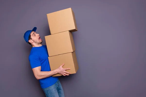 Close up photo profesionalis he him him his delivery boy hold strong hands large heavy parcel boxes flat move Letih stressed wear blue t-shirt cap jeans denim isolated grey background — Stok Foto