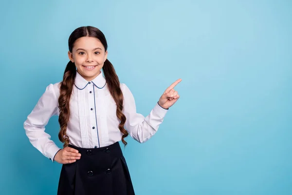 Portrait of lovely kid choose decide ads wear blouse white trendy skirt isolated over blue background — Stock Photo, Image
