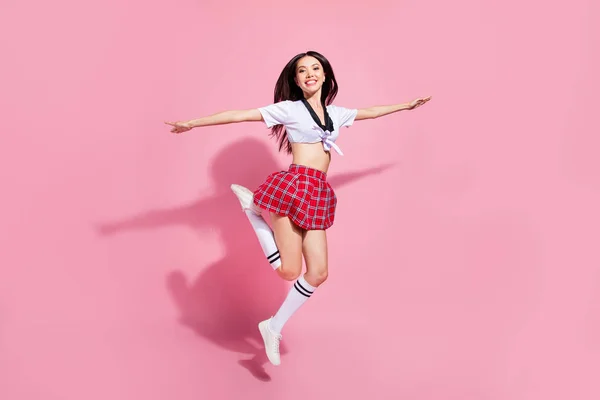 Full length body size view of her she nice-looking attractive lovely charming slender cheerful straight-haired lady having fun flying like plane isolated over pink pastel background — стоковое фото