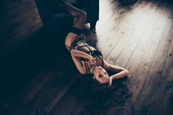 Top above high angle view of nice lovely charming gorgeous attractive stunning perfect sportive figure lady wearing swordbelt teasing lying on floor enjoying lifestyle at house loft interior wood — Stock Photo, Image