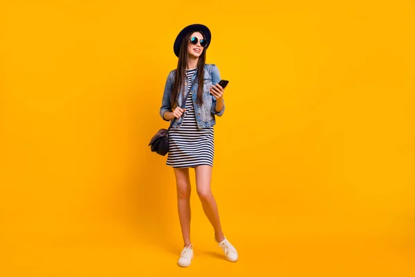 Full length body size view portrait of her she nice charming attractive cheerful cheerful straight-haired lady sunny day dream isolated over bright vivid shine yellow background — стоковое фото