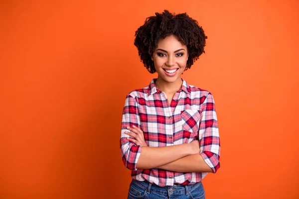 Portrait of her she nice attractive lovable lovely cheerful cheery content wavy-haired lady wearing checked shirt folded arms isolated on bright vivid shine orange background — Stock Photo, Image