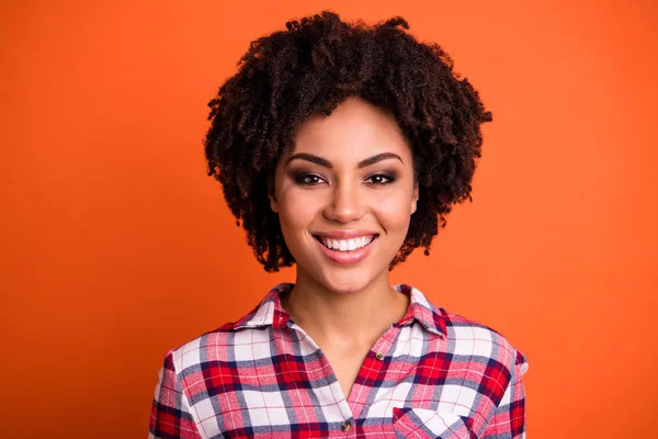 Close-up portrait of her she nice-looking attractive lovely charming cheerful cheery wavy-haired lady smokey eyes wearing checked shirt isolated over bright vivid shine orange background — Stock Photo, Image