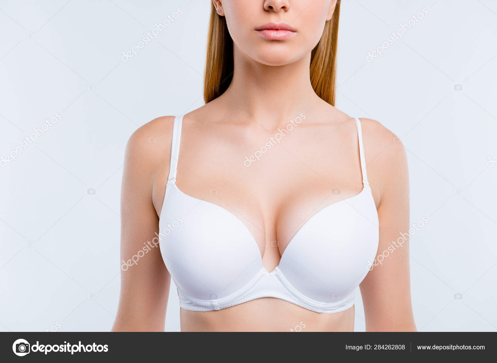 Healthy lifestyle concept. Cropped close-up portrait of nice calm lovely  attractive adorable blonde girl chest wearing bra isolated over light gray  background Stock Photo by ©deagreez1 284262808