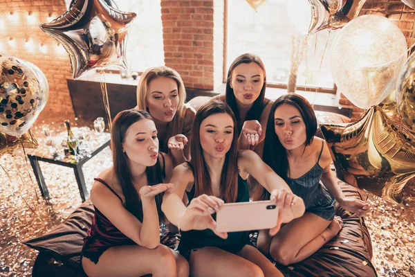 Company of nice attractive sweet flirty charming lovely lovable feminine ladies making selfie sending kiss in decorated glow glossy shine loft industrial brick interior style interior room house — Stock Photo, Image