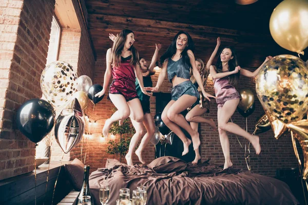 Low below angle full length body size view of nice attractive slim fit adorable cheerful crazy group having fun great free time in hostel loft industrial style interior room house indoors — Stock Photo, Image