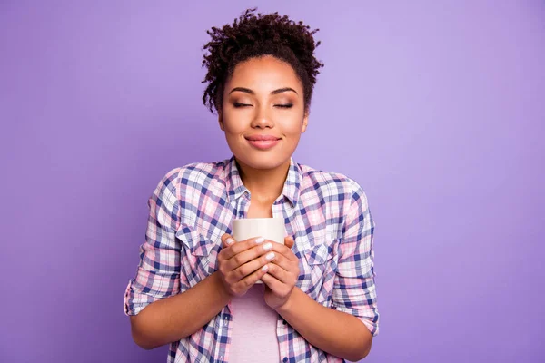 Portrait of satisfied charming lady people take mug hot beverage have weekend free time holidays wear checkered shirt top-knot isolated on purple background — Stock Photo, Image