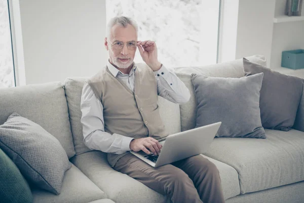 Close up photo amazing intelligent he him his aged man hands arms notebook search look information writing keyboard wear white shirt waistcoat pants sit cozy divan flat house living room indoors — Stock Photo, Image
