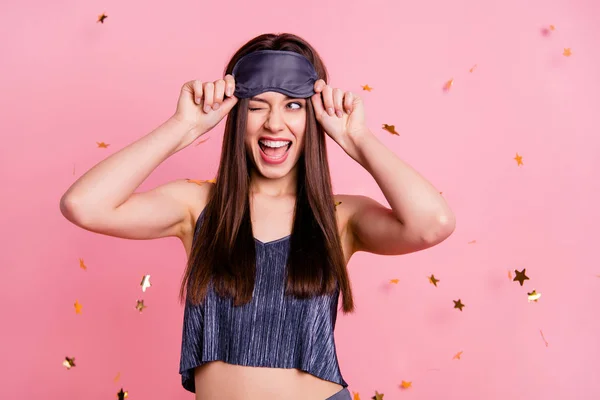 Close up photo beautiful amazing she her lady hands hold head chin glitter gold stars falling down enjoy overjoyed wear blue silky sleeping suit costume mask isolated pink background — стоковое фото