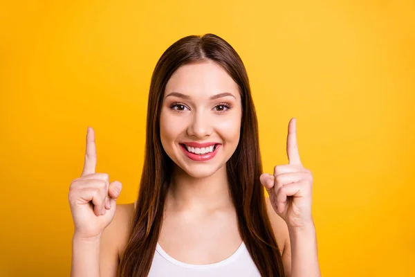 Close up photo beautiful funny she her her lady ideal perfect appearance hands arms index fingers indicate up empty space advising comprar comprador use casual white tank-top isolated bright yellow background — Foto de Stock