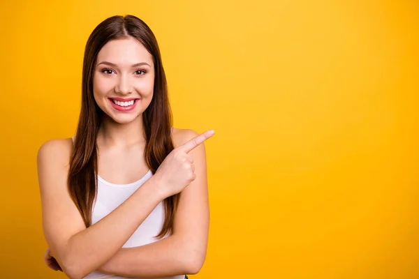 Close up photo beautiful amazing she her her lady ideal perfect appearance hand arm index finger indicate empty space advising comprar comprador use casual white tank-top isolated bright yellow background — Foto de Stock